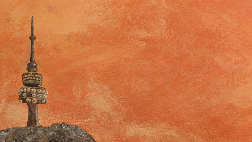 Telsta Tower on Black Mountain against an orange sky